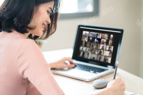 Preview: Asian business woman talking to colleague team about plan in video conference at home.