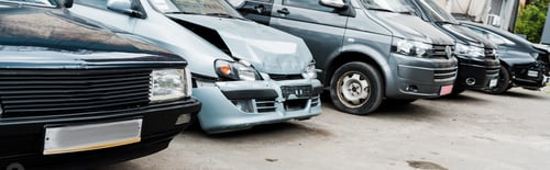 Preview: panoramic shot of damaged vehicle after car accident near modern automobiles