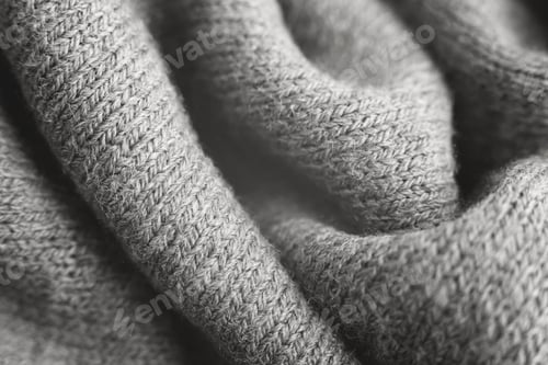 Preview: Close up of grey knitted textured background.