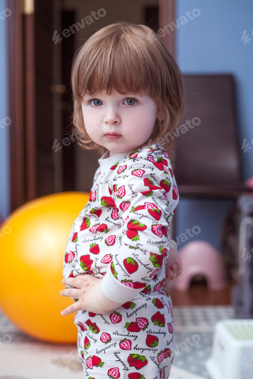 Preview: Baby girl playing with toys in the children's room