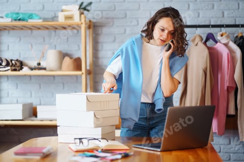 Preview: Small business owner, entrepreneur, seller using tablet checking ecommerce clothing store orders.