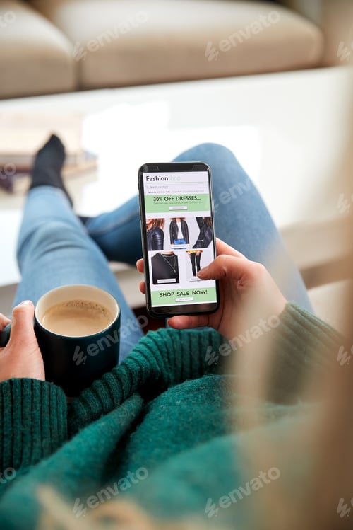 Preview: Close Up Of Woman Shopping For Clothes Online Using Mobile Phone App