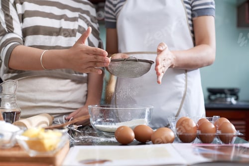 Preview: Female Cooks Sieving Flour