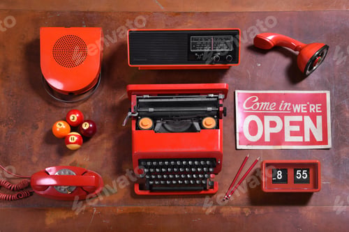 Preview: Collection of Red Vintage Objects on Wood Desk