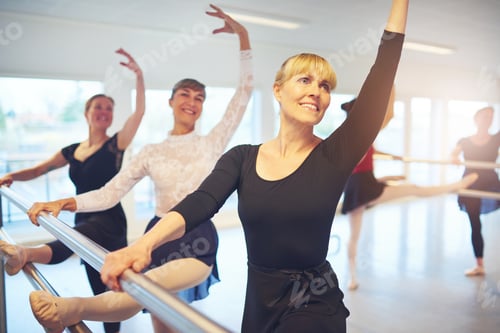 Preview: Smiling women posing and doing gymnastics in ballet class