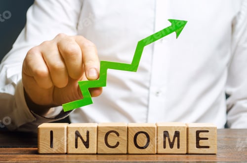 Preview: Wooden blocks with the word Income and the up arrow in the hands of businessmen