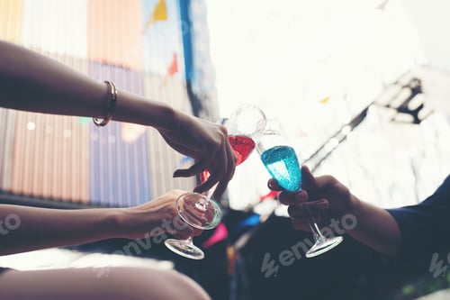 Preview: Portrait of happy young friends having fun and drinking together.