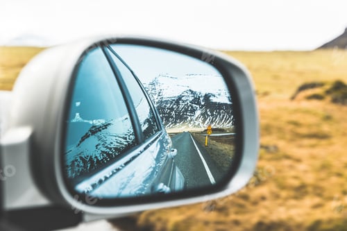 Preview: Snow and mountains view on wing mirror
