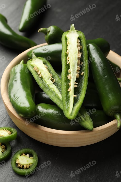 Preview: Ripe green jalapeno peppers on grey table, closeup
