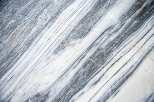 Preview: Natural background. A section of marble stone. A rock made of marble. Pyramids of stones