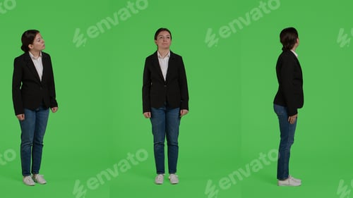 Preview: Caucasian businesswoman wearing formal suit standing over full body greenscreen