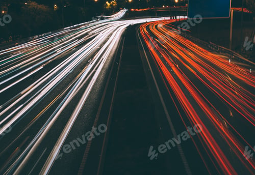 Preview: Traffic lights at night on road