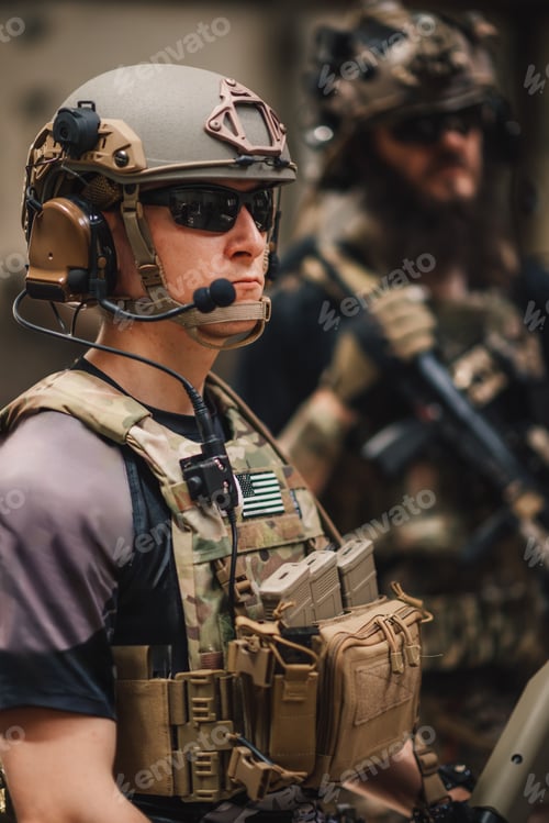 Preview: Close up of brave soldier in military uniform at ruins ready for action