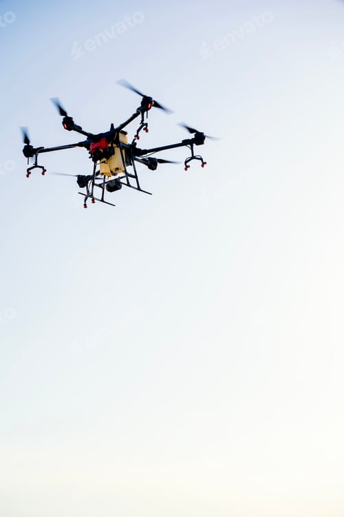 Preview: Industrial drone flies over a green field and sprays pesticides to increase productivity and destroy
