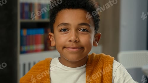 Preview: Child son schoolboy studying at desk school classroom elementary education little African American