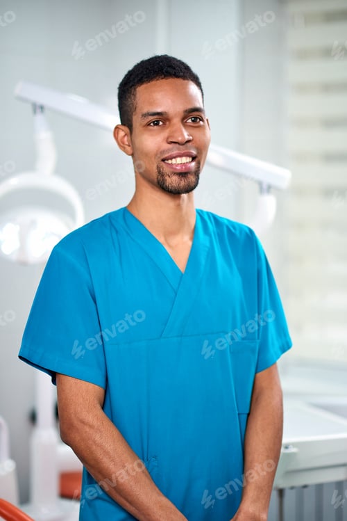 Preview: African male dentist smiling