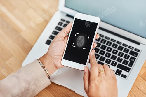 Preview: Shot of an unrecognizable businesswoman using a cellphone and laptop in her office