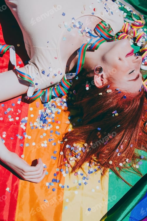 Preview: Young redhead woman celebrating gay pride day