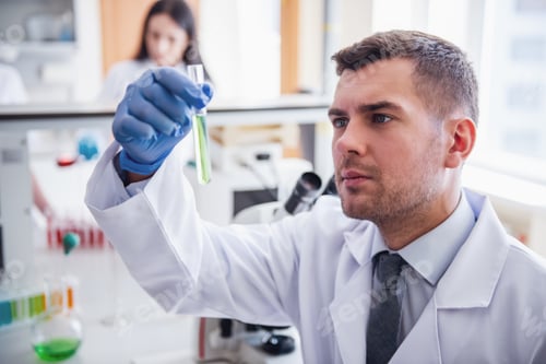Preview: Researcher Holding a Test Tube in a Laboratory