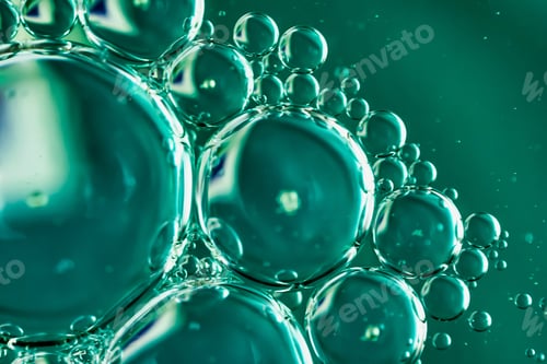 Preview: oil drops on water on blue background