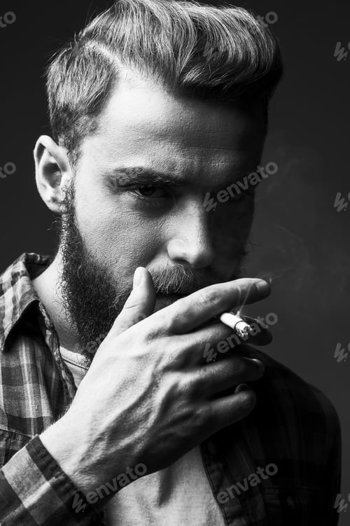 Preview: Bearded man smoking.