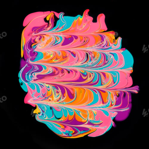 Preview: Close-up shot of thick paint of various bright colors flowing down and mixing together