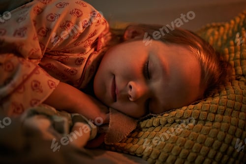 Preview: Caucasian Child Girl Sleeping Peacefully on Pillow during Evening at Home