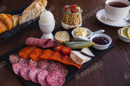 Preview: Brunch or breakfast set, meal variety with boil egg, salami, meat and cheese variety, granola