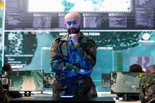Preview: Military staff examining a projection on hologram in command center