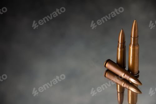Preview: front view of brown bullets on gray background gun death war shooting