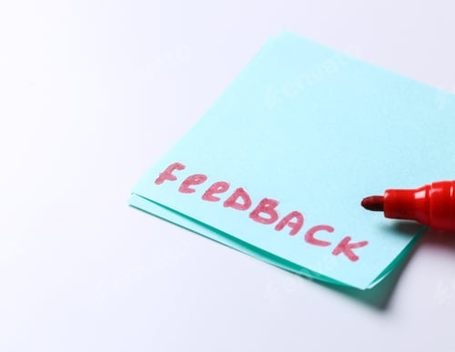 Feedback Note with Red Marker on White