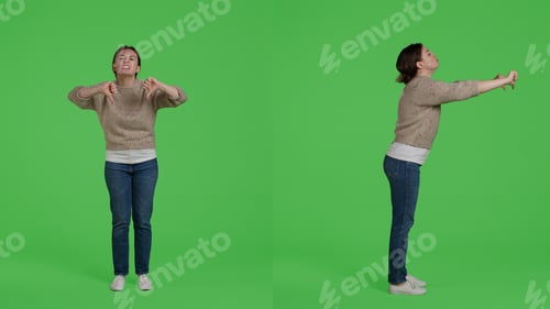 Preview: Female model showing thumbs down negative sign on camera