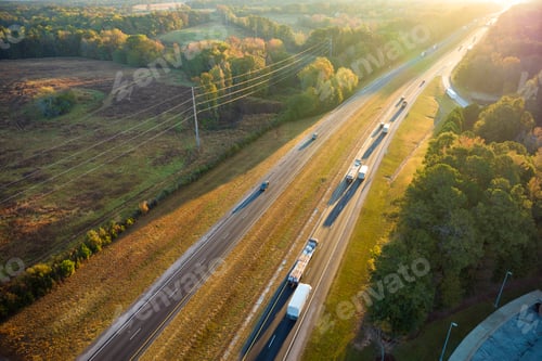 Preview: Aerial view of busy american freeway with fast moving cars and trucks.