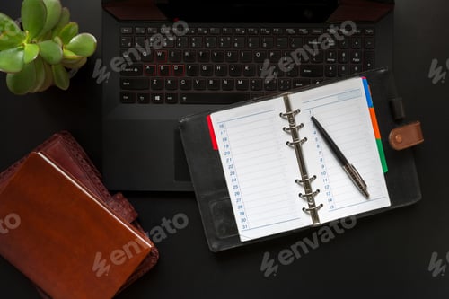 Preview: High angle view of office black desk with copy space. Table with keyboard, computer, coffee cup and