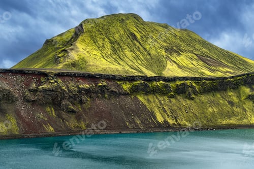 Preview: Moss-Covered Volcanic Mountain and Turquoise Lake