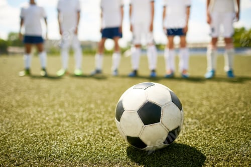 Preview: Ball on Grass in Junior Football Match