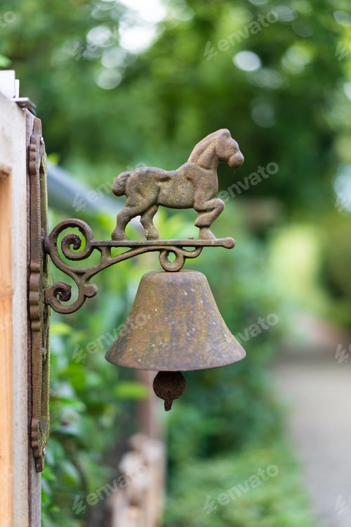 Preview: Rustic bell with horse ornament outdoors