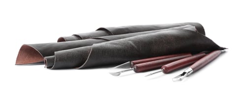 Preview: Leather samples and craftsman tools isolated on white