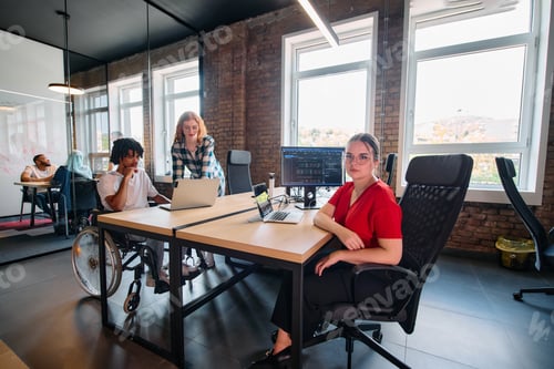 Preview: A diverse group of business professionals collaborates in a modern startup coworking center