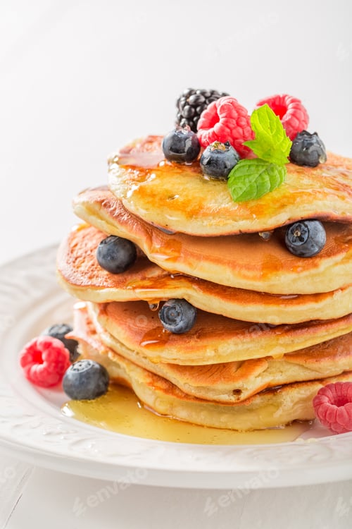 Preview: Sweet american pancakes with blueberries and raspberries