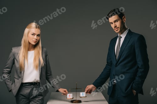 Preview: professional businesspeople with male and female signs on scales of justice, gender equality concept