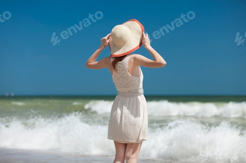 Preview: Redhead girl on the beack in spring time