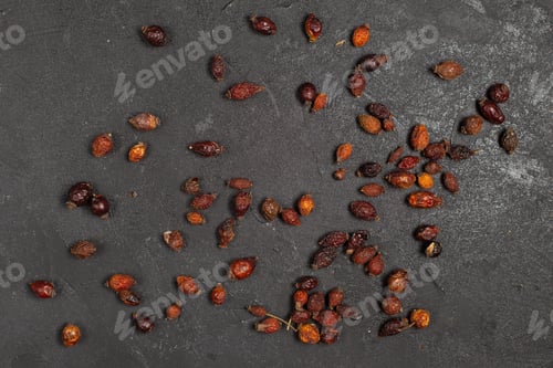 Preview: top view dried brown fruits isolated on the dark background fruit dry photo
