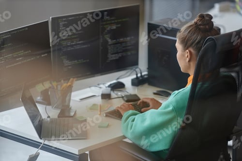 Preview: Woman working with security code on computer