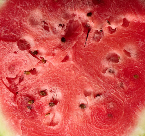 Preview: Texture of ripe red watermelon with brown seeds, full frame
