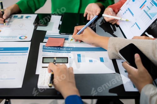 Preview: Finance managers meeting.using smart phone and laptop and digital tablet computer in modern office.