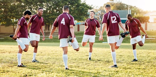 Preview: Rugby, sports and stretching with a team getting ready for training or a competitive game on a fiel
