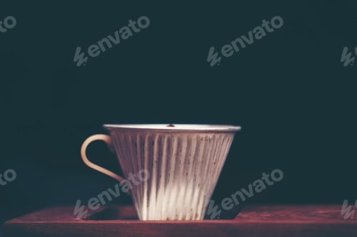 Preview: Close up of coffee brewing gadgets on wooden bar counter.