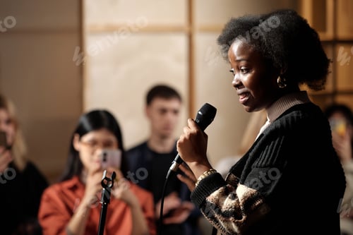 Preview: Woman performing in front of audience