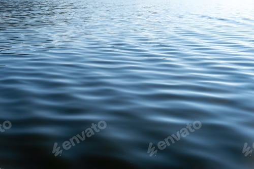 Preview: Sea water with small ripple background texture. Ocean surface blue color, empty template, copy space